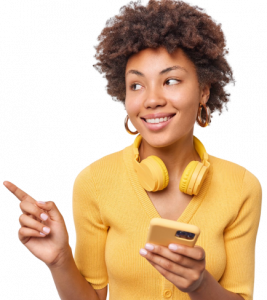 attractive-curly-haired-young-woman-with-gentle-smile-holds-modern-mobile-phone-headphones-around-neck-indicates-away-copy-space-dressed-casual-yellow-jumper-isolated-white-wall-1.png